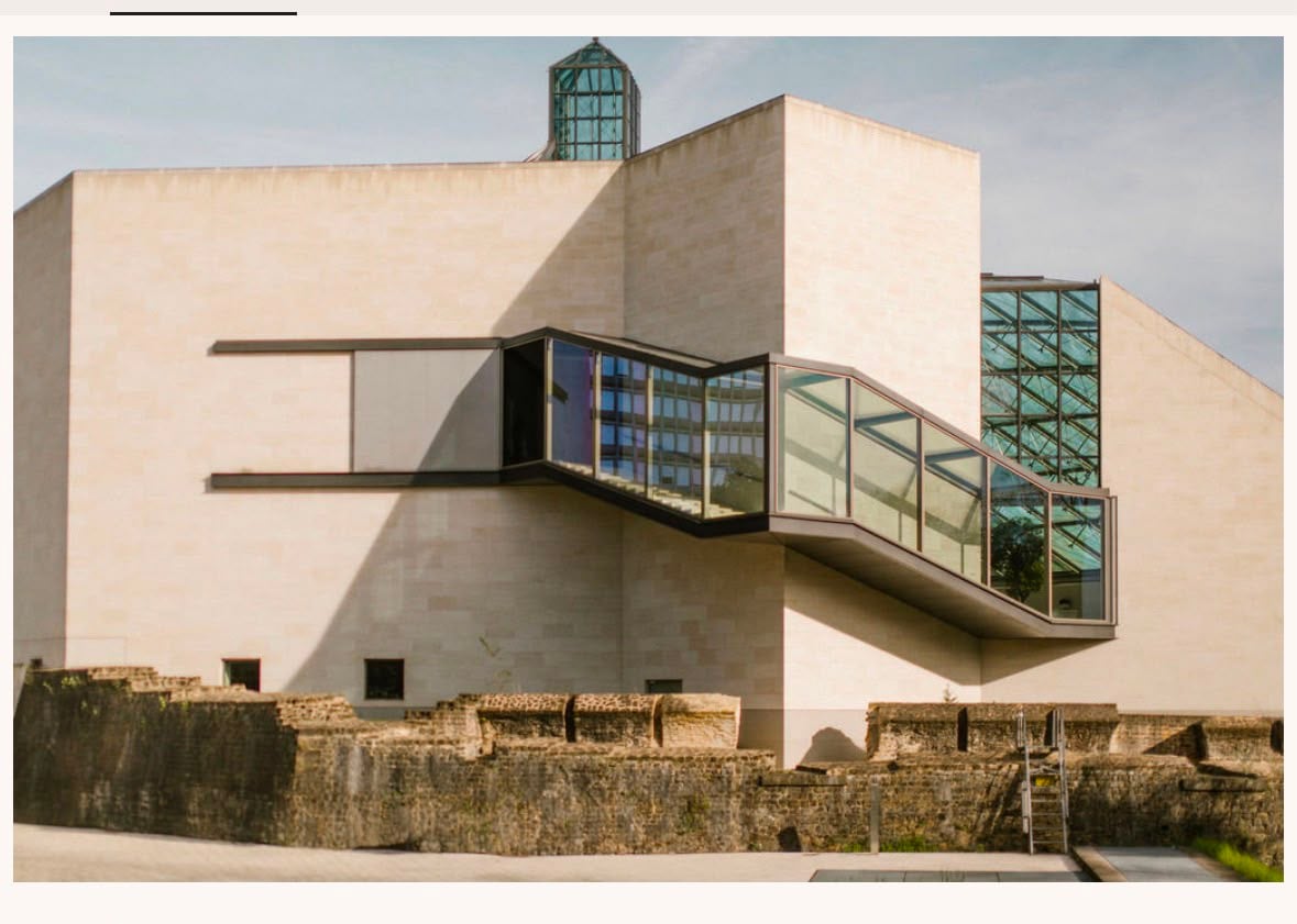 Mudam, the Grand Duke Jean Museum of Modern Art in Luxembourg — I. M. Pei's limestone galleries and glass stair rising from the ramparts of Fort Thüngen