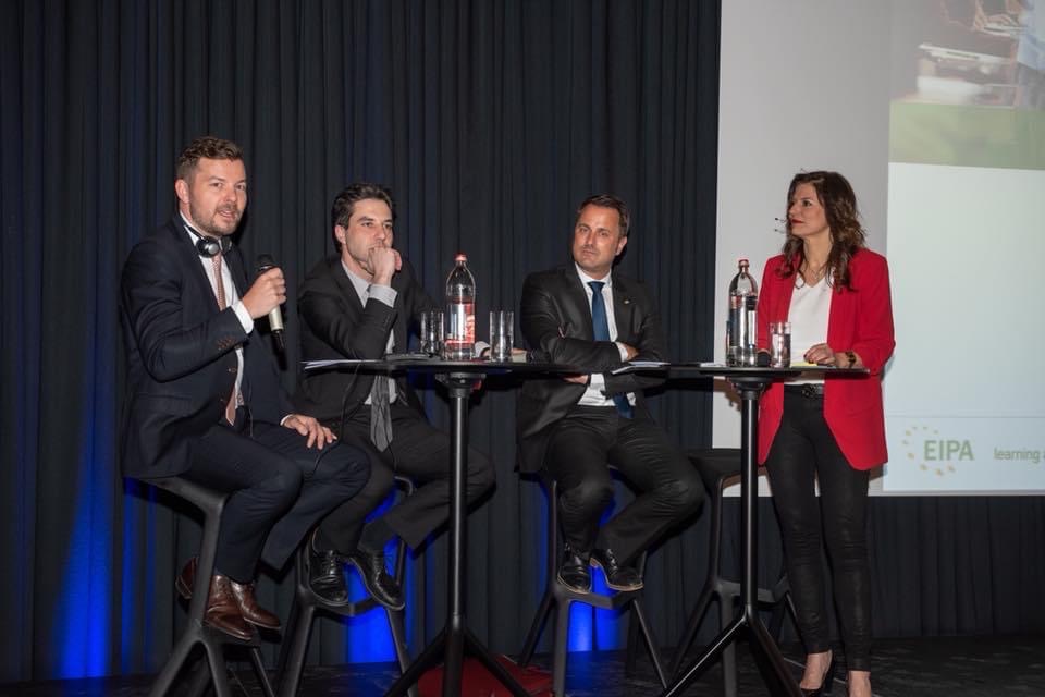 Tomasz Kramer on stage at EIPA alongside Luxembourg Prime Minister Xavier Bettel