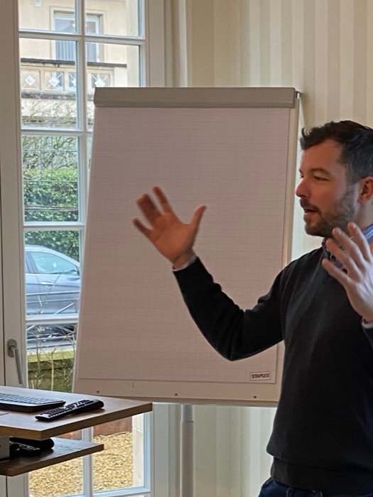 Tomasz Kramer delivering a hands-on AI training session